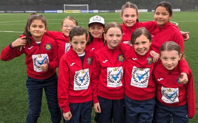 Shrewsbury Juniors U10 Girls football team wearing their new training kit sponsored by ISO-Cert Online Ltd